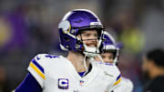 Jan 13, 2025; Glendale, AZ, USA; Minnesota Vikings quarterback Sam Darnold (14) against the Los Angeles Rams during an NFC wild card game at State Farm Stadium. 