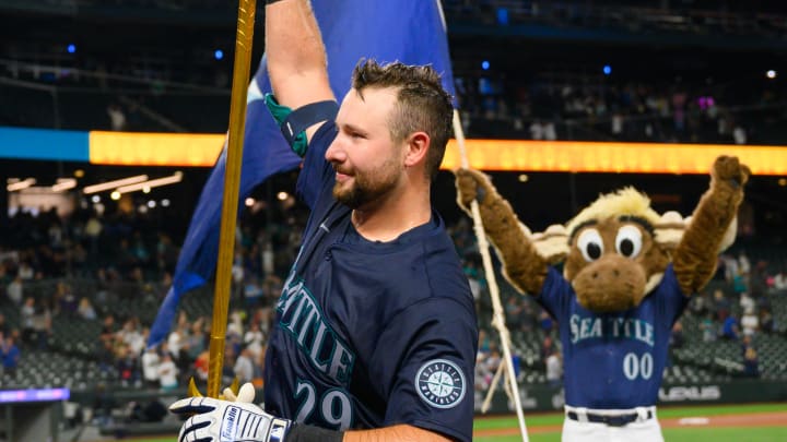 Seattle Mariners catcher Cal Raleigh (29) celebrates with fans after the Seattle Mariners defeated the Chicago White Sox at T-Mobile Park on June 10.