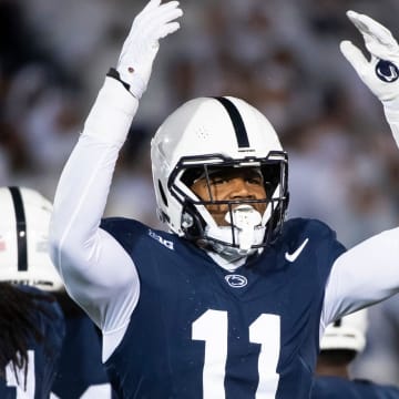 Penn State linebacker Abdul Carter motions to the crowd during the 2023 White Out game against Iowa at Beaver Stadium.