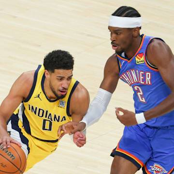 Jun 19, 2025; Indianapolis, Indiana, USA; Indiana Pacers guard Tyrese Haliburton (0) drives to the basket against Oklahoma City Thunder guard Shai Gilgeous-Alexander (2) in the first quarter during game six of the 2025 NBA Finals at Gainbridge Fieldhouse. Mandatory Credit: Trevor Ruszkowski-Imagn Images