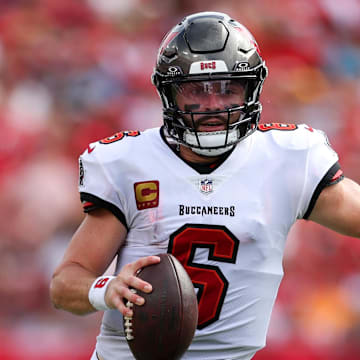 aSep 8, 2024; Tampa, Florida, USA; Tampa Bay Buccaneers quarterback Baker Mayfield (6) runs with the ball against the Washington Commanders in the first quarter at Raymond James Stadium. Mandatory Credit: Nathan Ray Seebeck-Imagn Images