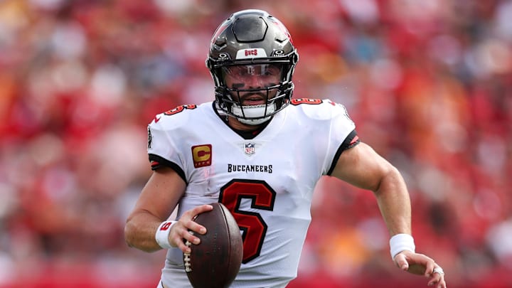 aSep 8, 2024; Tampa, Florida, USA; Tampa Bay Buccaneers quarterback Baker Mayfield (6) runs with the ball against the Washington Commanders in the first quarter at Raymond James Stadium. Mandatory Credit: Nathan Ray Seebeck-Imagn Images