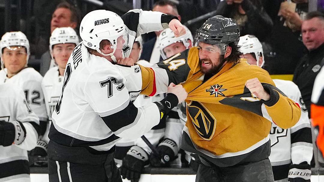 Mar 9, 2025; Las Vegas, Nevada, USA; Los Angeles Kings center Samuel Helenius (79) fights Vegas Golden Knights defenseman Nicolas Hague (14) during the second period at T-Mobile Arena. Mandatory Credit: Stephen R. Sylvanie-Imagn Images
