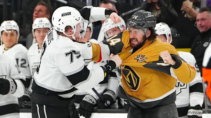 Mar 9, 2025; Las Vegas, Nevada, USA; Los Angeles Kings center Samuel Helenius (79) fights Vegas Golden Knights defenseman Nicolas Hague (14) during the second period at T-Mobile Arena. Mandatory Credit: Stephen R. Sylvanie-Imagn Images