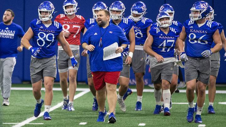 Kansas offensive coordinator Andy Kotelnicki works through drills during practice Tuesday in Lawrence.