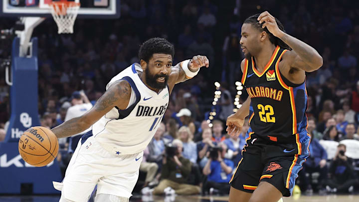 Nov 17, 2024; Oklahoma City, Oklahoma, USA; Dallas Mavericks guard Kyrie Irving (11) drives around Oklahoma City Thunder guard Cason Wallace (22) during the second quarter at Paycom Center. Mandatory Credit: Alonzo Adams-Imagn Images Nov 17, 2024; Oklahoma City, Oklahoma, USA; Dallas Mavericks guard Kyrie Irving (11) drives around Oklahoma City Thunder guard Cason Wallace (22) during the second quarter at Paycom Center. Mandatory Credit: Alonzo Adams-Imagn Images