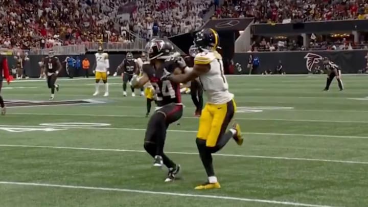 Pittsburgh Steelers receiver George Pickens shoves Atlanta Falcons cornerback A.J. Terrell Jr. when trying to catch a ball.