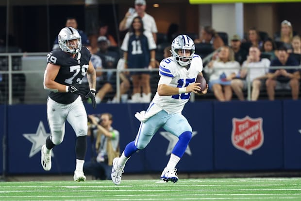 Dallas Cowboys QB Will Grier runs past Las Vegas Raiders defensive end George Tarlas 