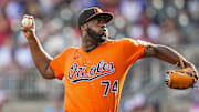Jul 5, 2025; Cumberland, Georgia, USA; Baltimore Orioles relief pitcher Felix Bautista (74) pitches against the Atlanta Braves during the ninth inning at Truist Park. Mandatory Credit: Dale Zanine-Imagn Images