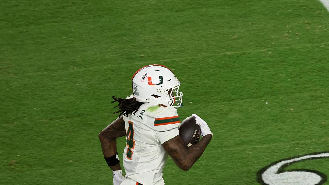 Jan 19, 2026; Miami Gardens, FL, USA; Miami Hurricanes running back Mark Fletcher Jr. (4) carries the ball for a touchdown against the Indiana Hoosiers in the third quarter during the College Football Playoff National Championship game at Hard Rock Stadium. Mandatory Credit: Kim Klement Neitzel-Imagn Images