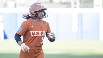 Jun 5, 2024; Oklahoma City, OK, USA;  Texas Longhorns utility Mia Scott (10) rounds the bases after hitting a solo  home run in the first inning against the Oklahoma Sooners during game one of the Women's College World Series softball championship finals at Devon Park. Mandatory Credit: Brett Rojo-Imagn Images