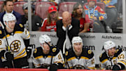 Oct 8, 2024; Sunrise, Florida, USA; Boston Bruins head coach Jim Montgomery reacts from the bench against the Florida Panthers during the third period at Amerant Bank Arena. Mandatory Credit: Sam Navarro-Imagn Images