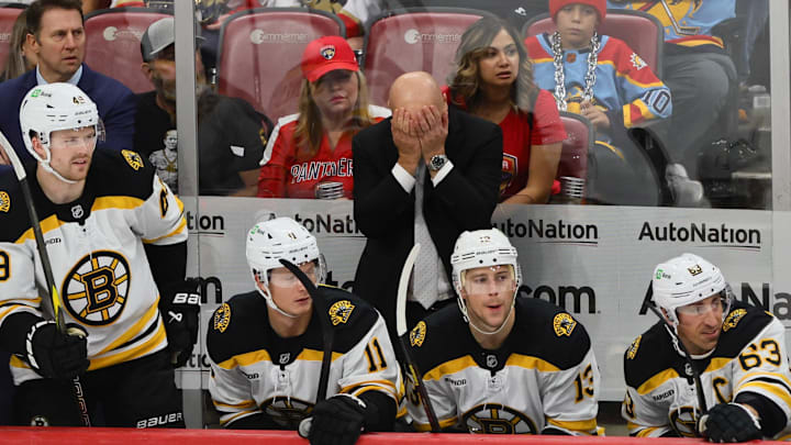 Oct 8, 2024; Sunrise, Florida, USA; Boston Bruins head coach Jim Montgomery reacts from the bench against the Florida Panthers during the third period at Amerant Bank Arena. Mandatory Credit: Sam Navarro-Imagn Images Oct 8, 2024; Sunrise, Florida, USA; Boston Bruins head coach Jim Montgomery reacts from the bench against the Florida Panthers during the third period at Amerant Bank Arena. Mandatory Credit: Sam Navarro-Imagn Images