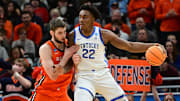 Kentucky Wildcats center Amari Williams looks to pass against Illinois Fighting Illini center Tomislav Ivisic in the second round of the NCAA Tournament at Fiserv Forum. 