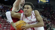 Wisconsin guard John Tonje (9) drives past UW-River Falls guard Dylan Parker (12) during the second half of their preseason game Wednesday, October 30, 2024 at the Kohl Center in Madison, Wisconsin. Wisconsin beat UW-River Falls 78-62.