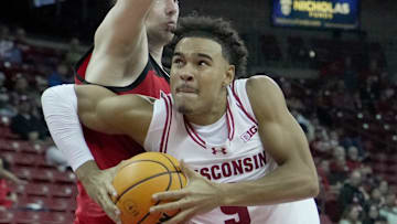 Wisconsin guard John Tonje (9) drives past UW-River Falls guard Dylan Parker (12) during the second half of their preseason game Wednesday, October 30, 2024 at the Kohl Center in Madison, Wisconsin. Wisconsin beat UW-River Falls 78-62.