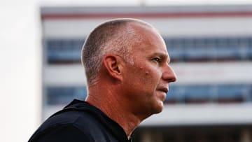 Aug 28, 2025; Raleigh, North Carolina, USA; North Carolina State Wolfpack head coach Dave Doeren looks on during the warmups prior to the game against East Carolina Pirates at Carter-Finley Stadium. Mandatory Credit: Jaylynn Nash-Imagn Images