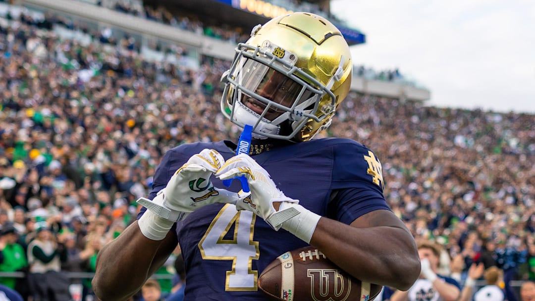 Notre Dame Fighting Irish running back Jeremiyah Love celebrates scoring against the Syracuse Orange 