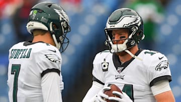 Former Philadelphia Eagles quarterback Nate Sudfeld (7) and quarterback Carson Wentz (11) talk prior to the game against the Buffalo Bills at New Era Field.