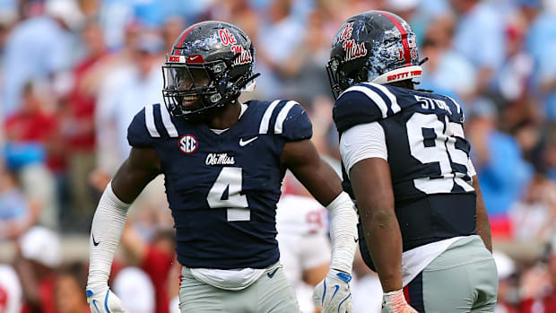 Mississippi Rebels linebacker Suntarine Perkins, left, and defensive tackle Akelo Stone celebrate a fourth-down stop