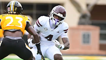 Mississippi State Bulldogs wide receiver Jordan Mosley (4) runs the ball while defended by Southern Miss Golden Eagles cornerback Anthony Richard Jr. (23) during the first quarter at M.M. Roberts Stadium in Hattiesburg, Miss., on Aug. 30, 2025.