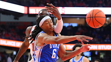 Feb 5, 2025; Syracuse, New York, USA; Duke basketball forward Maliq Brown (6) gets hit in the face by Syracuse Orange center Naheem McLeod (back) while reaching for the ball during the second half at the JMA Wireless Dome.