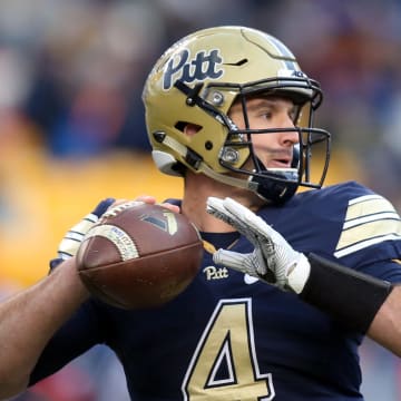 Nov 26, 2016; Pittsburgh, PA, USA;  Pittsburgh Panthers quarterback Nathan Peterman (4) passes against the Syracuse Orange during the third quarter at Heinz Field. PITT won 76-61. Mandatory Credit: Charles LeClaire-USA TODAY Sports