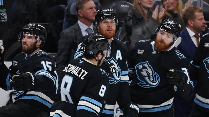 Apr 9, 2026; Salt Lake City, Utah, USA; Utah Mammoth center Nick Schmaltz (8) celebrates with center Alexander Kerfoot (15), left wing Lawson Crouse (67) and center Liam O'Brien (38) after scoring a goal against the Nashville Predators during the second period at Delta Center. Mandatory Credit: Rob Gray-Imagn Images