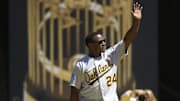 Aug 25, 2019; Oakland, CA, USA; Former Oakland Athletics outfielder Rickey Henderson acknowledges the crowd during a ceremony to honor the 30th anniversary of the 1989 World Series championship team before an MLB Players' Weekend game at Oakland Coliseum. Mandatory Credit: D. Ross Cameron-Imagn Images