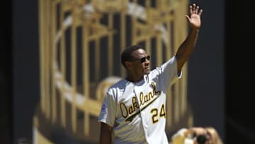 Aug 25, 2019; Oakland, CA, USA; Former Oakland Athletics outfielder Rickey Henderson acknowledges the crowd during a ceremony to honor the 30th anniversary of the 1989 World Series championship team before an MLB Players' Weekend game at Oakland Coliseum. Mandatory Credit: D. Ross Cameron-Imagn Images
