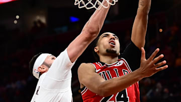 Oct 7, 2025; Cleveland, Ohio, USA; Chicago Bulls forward Noa Essengue (24) drives to the basket against Cleveland Cavaliers forward Larry Nance Jr. (22) during the second half at Rocket Arena.