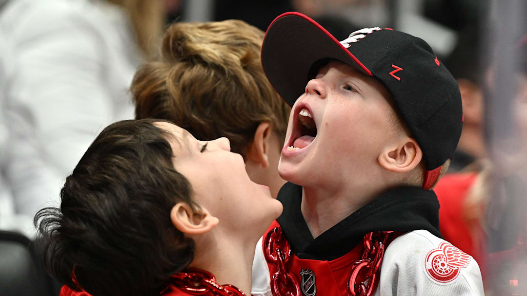 Nov 28, 2025; Detroit, Michigan, USA; Young Detroit Red Wings fans make as much noise as they can during the third period at Little Caesars Arena. Mandatory Credit: Lon Horwedel-Imagn Images