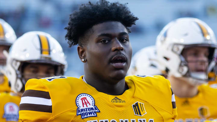 Dec 30, 2022; Tucson, AZ, USA; Wyoming Cowboys defensive tackle Jaden Williams (91) against the Ohio Bobcats during the 2022 Barstool Sports Arizona Bowl at Arizona Stadium. Mandatory Credit: Mark J. Rebilas-Imagn Images