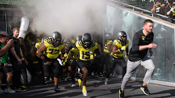 Oregon coach Dan Lanning leads his team onto the field veer their game against Illinois at Autzen Stadium in Eugene Saturday, Oct 26, 2024.