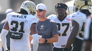 Jul 28, 2025; Metairie, LA, USA;  New Orleans Saints defensive coordinator Brandon Staley gives direction to safety Jordan Howden (31) at Ochsner Sports Performance Center. Mandatory Credit: Stephen Lew-Imagn Images