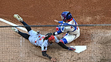 Sep 28, 2025; Philadelphia, Pennsylvania, USA; Minnesota Twins outfielder Austin Martin (16) slides safely into home ahead of tag by Philadelphia Phillies catcher Rafael Marchán (13) during the sixth inning at Citizens Bank Park. Mandatory Credit: Eric Hartline-Imagn Images
