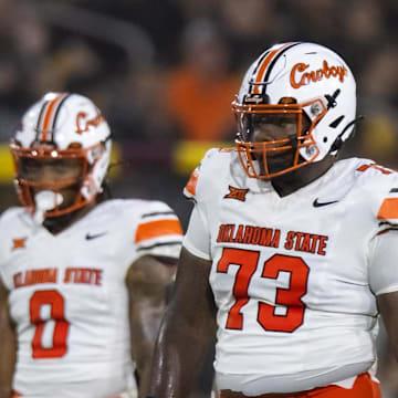 Sep 9, 2023; Tempe, Arizona, USA; Oklahoma State Cowboys offensive lineman Jason Brooks Jr. (73) against the Arizona State Sun Devils at Mountain America Stadium. Mandatory Credit: Mark J. Rebilas-Imagn Images