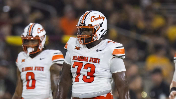 Sep 9, 2023; Tempe, Arizona, USA; Oklahoma State Cowboys offensive lineman Jason Brooks Jr. (73) against the Arizona State Sun Devils at Mountain America Stadium. Mandatory Credit: Mark J. Rebilas-Imagn Images