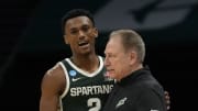 March 21, 2024, Charlotte, NC, USA; Michigan State Spartans guard Tyson Walker (2) talks with coach Tom Izzo against the Mississippi State Bulldogs in the first round of the 2024 NCAA Tournament at the Spectrum Center. Mandatory Credit: Bob Donnan-USA TODAY Sports