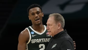 March 21, 2024, Charlotte, NC, USA; Michigan State Spartans guard Tyson Walker (2) talks with coach Tom Izzo against the Mississippi State Bulldogs in the first round of the 2024 NCAA Tournament at the Spectrum Center. Mandatory Credit: Bob Donnan-USA TODAY Sports