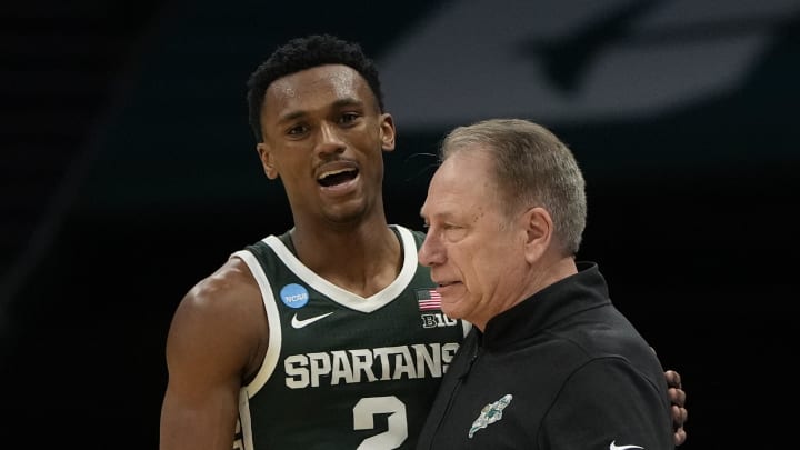 March 21, 2024, Charlotte, NC, USA; Michigan State Spartans guard Tyson Walker (2) talks with coach Tom Izzo against the Mississippi State Bulldogs in the first round of the 2024 NCAA Tournament at the Spectrum Center. Mandatory Credit: Bob Donnan-USA TODAY Sports