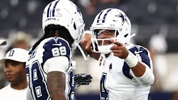 Dallas Cowboys quarterback Dak Prescott celebrates with wide receiver Ceedee Lambe against the Washington Commanders 