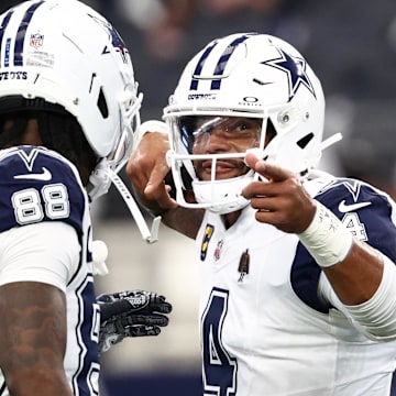 Dallas Cowboys quarterback Dak Prescott celebrates with wide receiver Ceedee Lambe against the Washington Commanders 