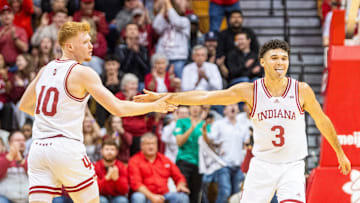 Indiana's Anthony Leal (3) celebrates with Luke Goode (10) during the Hoosiers' win over Penn State in Bloomington on Feb. 26.