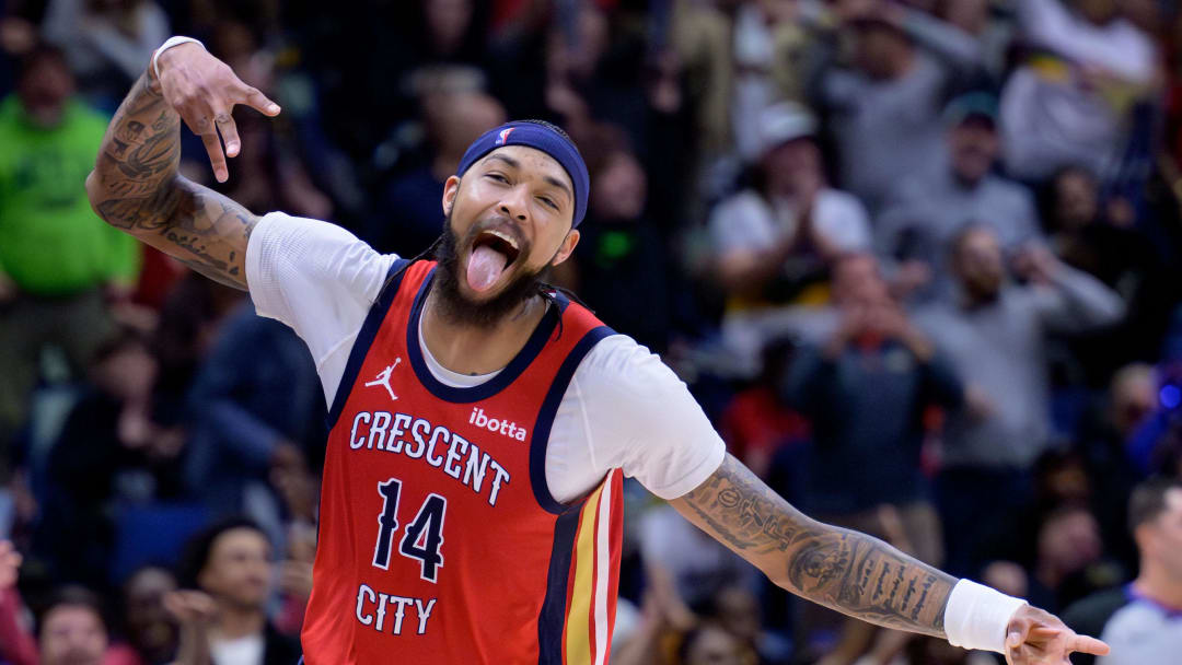 Feb 5, 2024; New Orleans, Louisiana, USA; New Orleans Pelicans forward Brandon Ingram (14) celebrates a three point basket against the Toronto Raptors during the second half at Smoothie King Center.