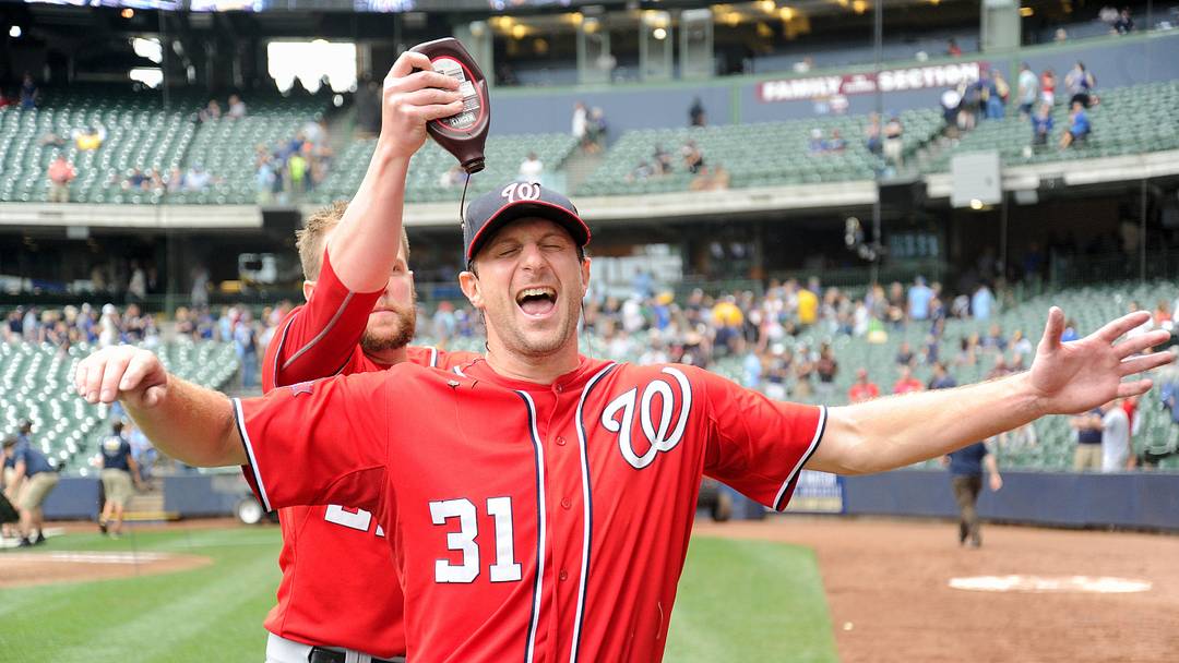 Jun 14, 2015; Milwaukee, WI, USA; Washington Nationals  pitcher Drew Storen (22) douse chocolate syrup on pitcher Max Scherzer (31) after Scherzer pitched a complete game shutout at Miller Park. The Nationals won 4-0. Mandatory Credit: Benny Sieu-USA TODAY Sports