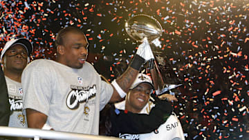 Feb 7, 2010; Miami, FL, USA; New Orleans Saints cornerback Tracy Porter (22) celebrates with the Lombardi Trophy after defeating the Indianapolis Colts 31-17 in Super Bowl XLIV at Sun Life Stadium. Mandatory Credit: Matthew Emmons-Imagn Images