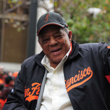 October 31, 2012; San Francisco, CA, USA; Former San Francisco Giants center fielder Willie Mays waves to the crowd while riding in a car during the World Series victory parade at Market Street. The Giants defeated the Detroit Tigers in a four-game sweep to win the 2012 World Series.