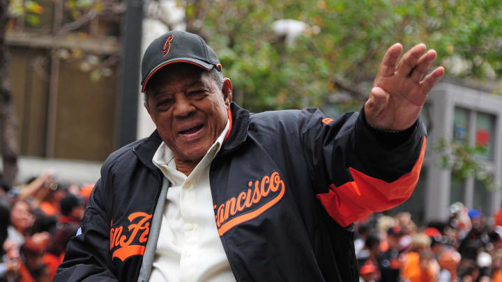 October 31, 2012; San Francisco, CA, USA; Former San Francisco Giants center fielder Willie Mays waves to the crowd while riding in a car during the World Series victory parade at Market Street. The Giants defeated the Detroit Tigers in a four-game sweep to win the 2012 World Series.