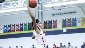 Newport's Taylen Kinney (0) goes up for two of his 13 points in the first half against Washington County at Wednesday's 2023 King of the Bluegrass basketball tournament at Fairdale High School. Dec. 20, 2023
